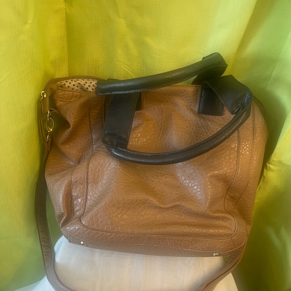 Brown bag with black shoulder straps